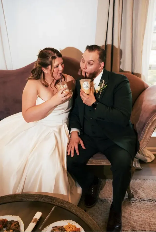Wedding guests relaxing with drinks from the Encounter Coffee cart